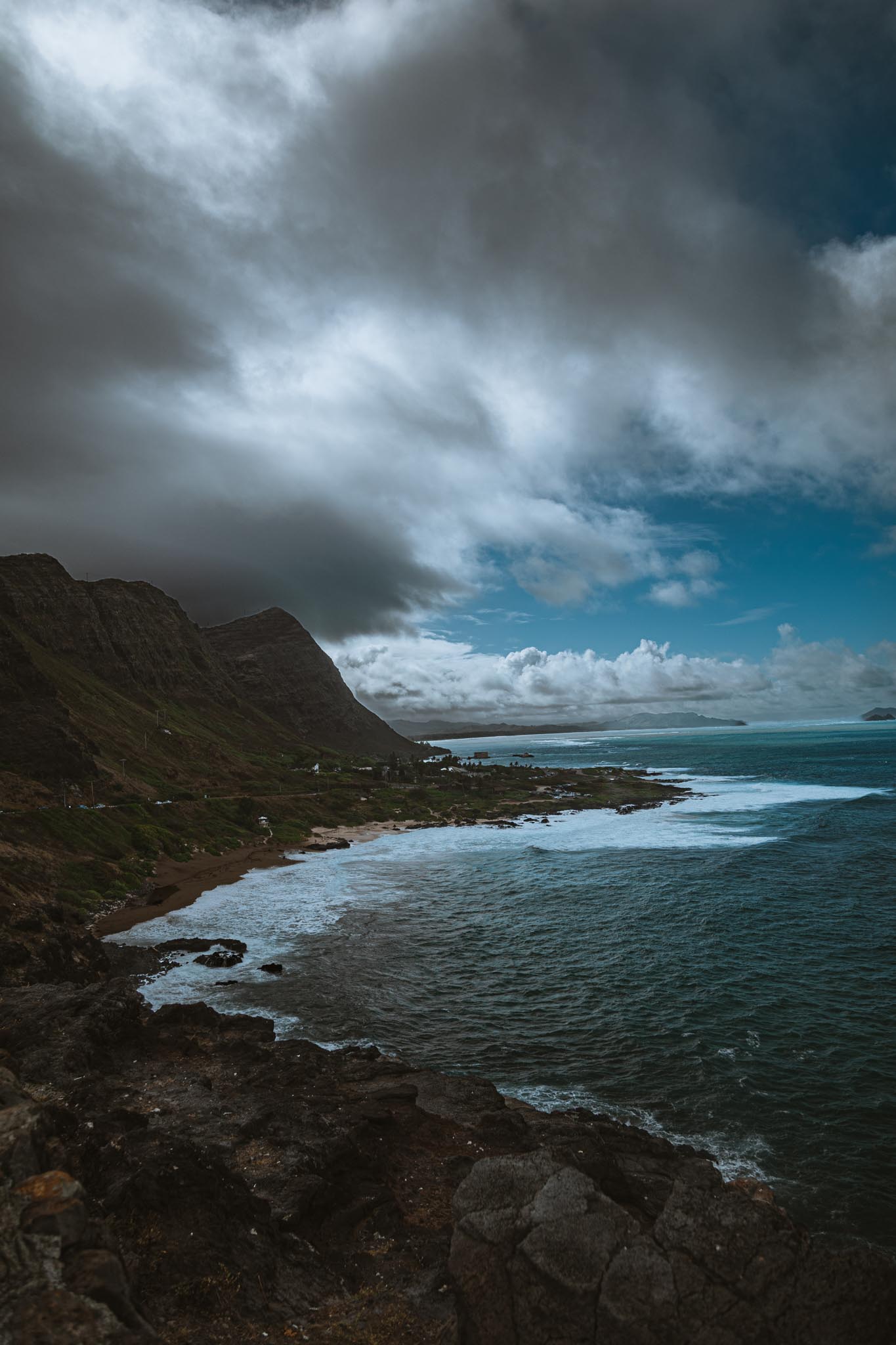 Blue water under a weathered sea cliff