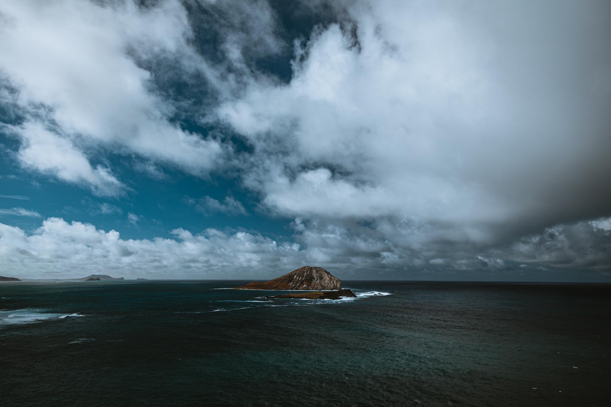 Rabbit Island under storm clouds off Oahu